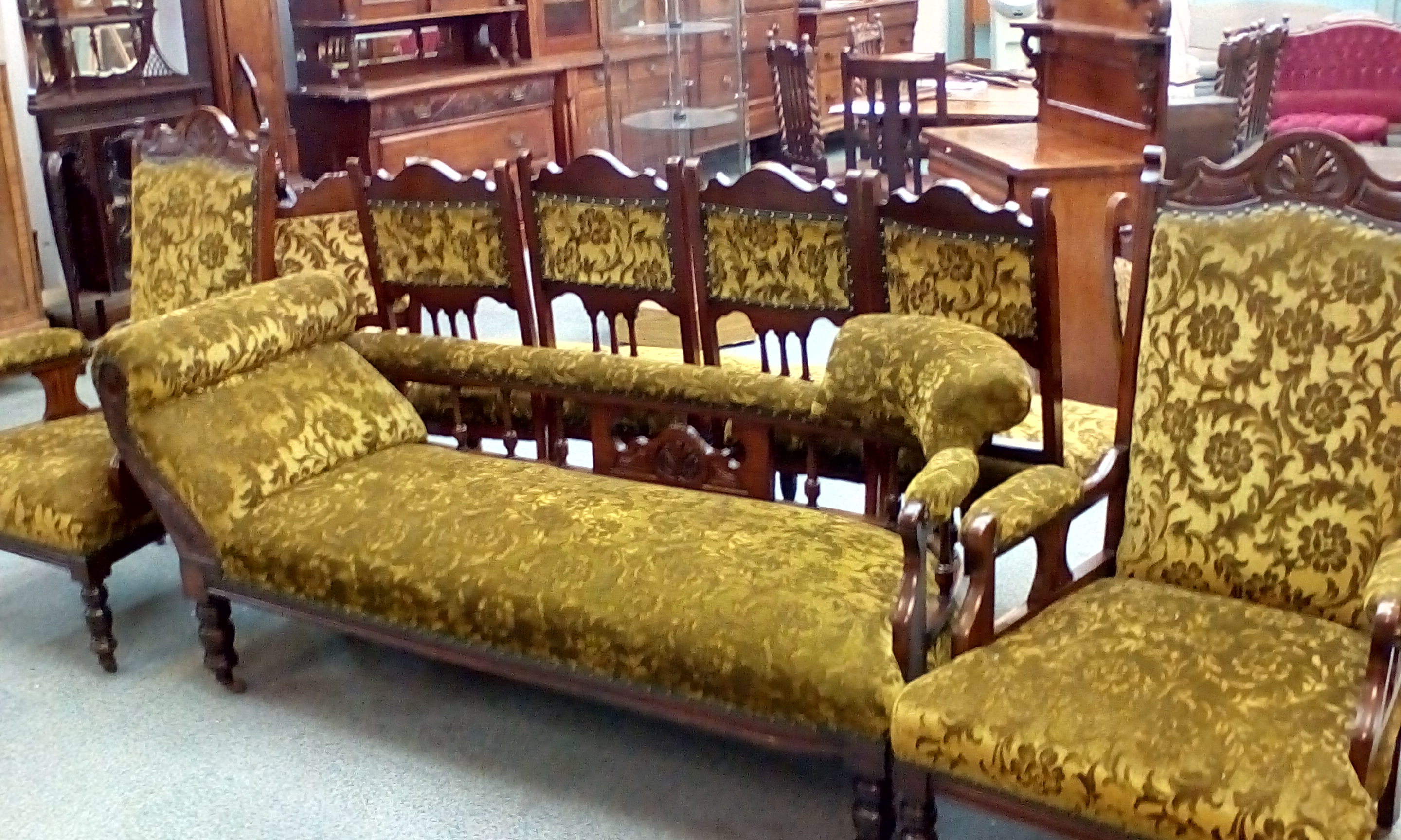 Victorian lounge suite, comprising saddle end chaise lounge, two ...