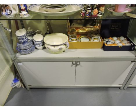 A Royal Doulton porcelain encrusted floral spray, a boxed porcelain tea set, a pair of boxed bisque jug spill vases, and two 