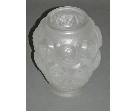 An Art Deco style Czechoslovakian moulded glass vase, white opaque with an intense rose bud decoration, H. 25cm 