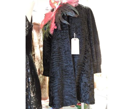A vintage Wakara ladies black Astrakan jacket.