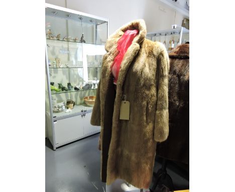 A vintage blonde musquash ladies 3/4 length fur coat, silk lined.