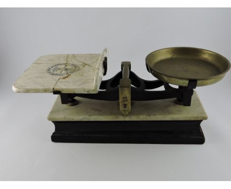 A pair of late 19th century balance scales by Parnell & Sons, with both brass and ceramic pans, 53 x 24 x 22cm.