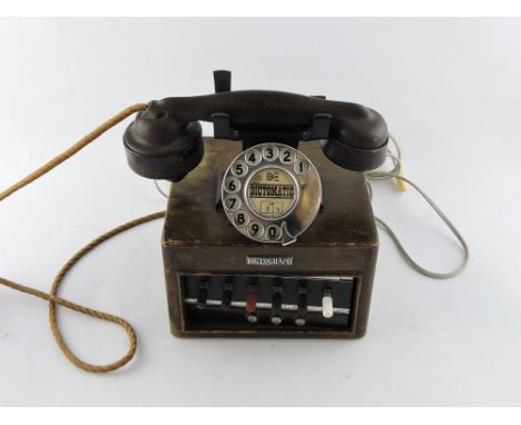 A vintage French beech cased operators cradle telephone.