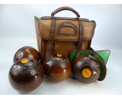 A set four vintage Slazenger lawn bowls in carrying bag
