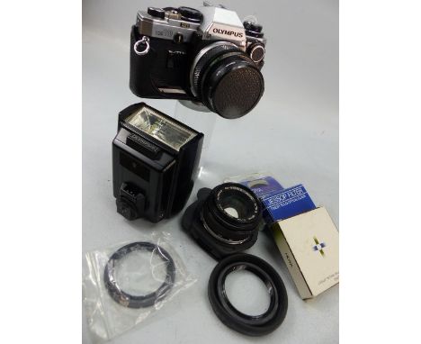 Olympus OM10 Camera with additional lens 50mm, flash gun and filters etc