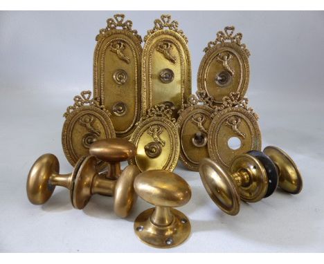 Collection of Victorian brass door furniture to include handles and single and double light switches