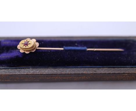 9ct gold stick pin set with a ruby 