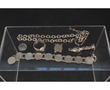 A silver watch chain, coin bracelet (as found), silver handle seal (as found) plus a white metal buckle ring