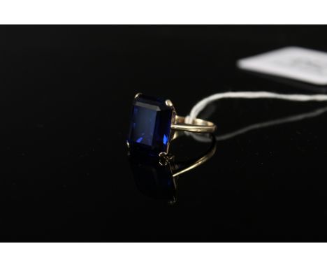 A 9ct gold ring set with a large blue stone, size K 1/2, weight approx 6g