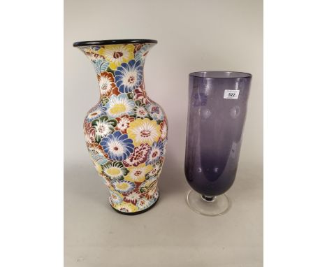 A large amethyst glass footed vase marked 'Parlane', 14 1/2cm high plus a large ceramic vase decorated with flowers, 53cm hig