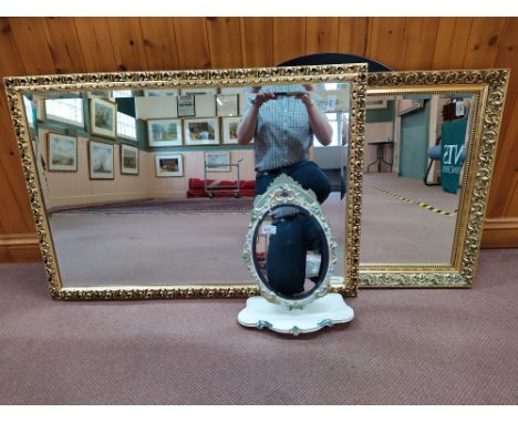 Two large gilt framed mirrors, a modern round black frame example and a vintage wood frame plus a painted plaster frame swing