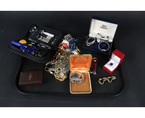 A mixed lot of costume jewellery, three ladies watches including Tissot, Seastar and Quartz plus a watch repairing kit