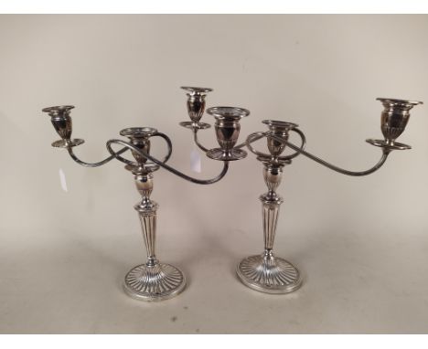 A pair of early 20th Century plated two branch candelabra in the Adam style