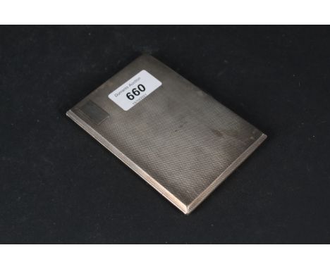 A large silver cigarette case with engine turned decoration, vacant cartouche to front, presentation inscription to inside, h