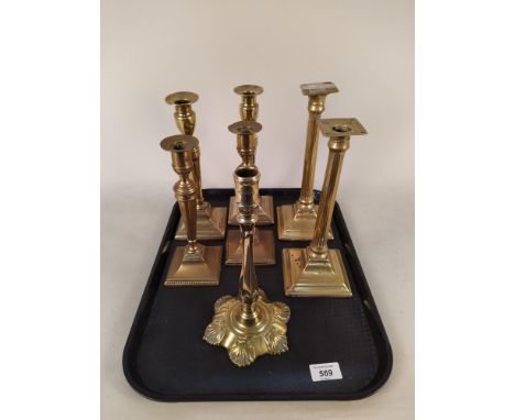 Three pairs of late 18th Century square base brass candlesticks plus a petal base brass candlestick
