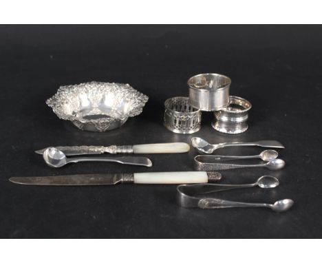 Mixed silver and silver plated items consisting of an embossed bon bon dish, two silver napkins rings, a pair of silver condi