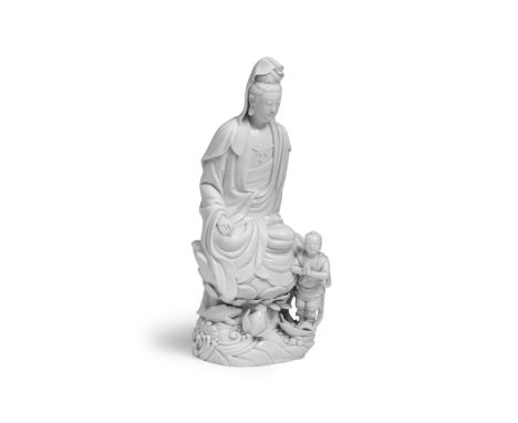 A BLANC-DE-CHINE FIGURE OF GUANYIN AND ACOLYTEChen Wei impressed seal mark, 18th centuryThe deity seated on a lotus plinth ri