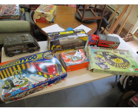 Three Micro Machines trucks together with two Scalextric style sets and a remote control carLocation: RAB 