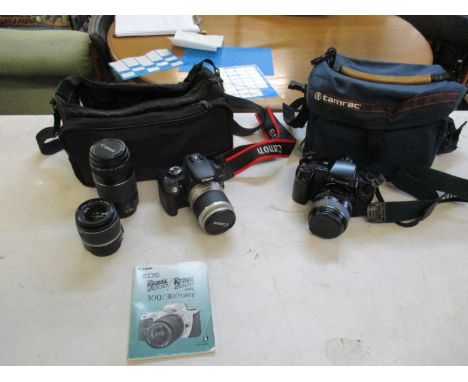 A Canon EOS 350D digital camera with three lenses and travel bag together with a Canon EOS 100 film camera with travel bagLoc