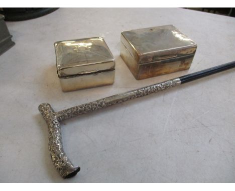 An early 20th century ebony walking stick with ornate silver handle together with two silver cigarette boxesLocation: Porters