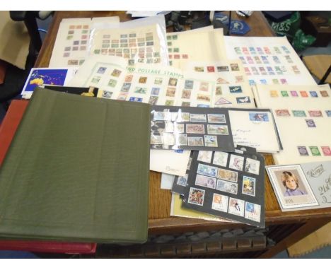 Three stamp albums and various loose pages of stamps from around the world and the Commonwealth Location: 5.3 