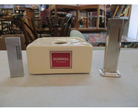 A vintage Dunhill tallboy lighter together with a Dunhill ashtray and a Colibri duo-flame lighterLocation: Porter 