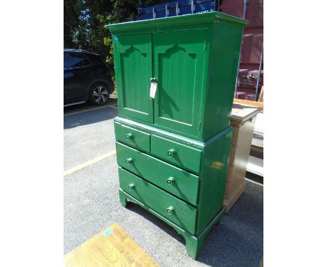 A 19th century green painted side cabinet, the top with twin arched panelled doors, above a base of two short and two long dr