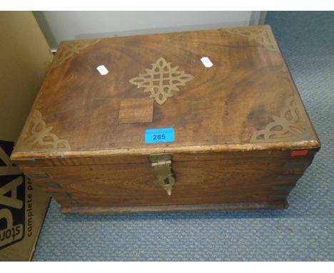 An Asian hardwood box with brass inlaid decoration and twin carrying handles, tray compartment and drawers underneath, on fou