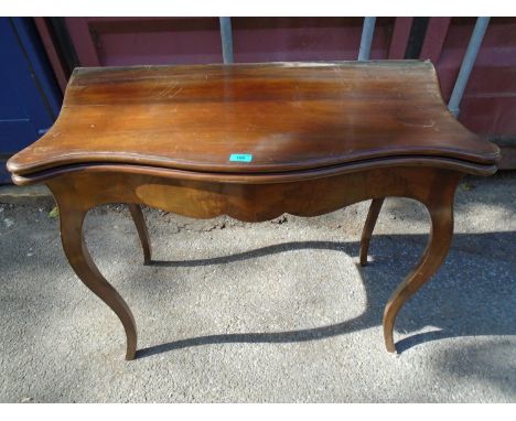 A walnut fold over card table, 72 x 89 x 88cm (when extended) 