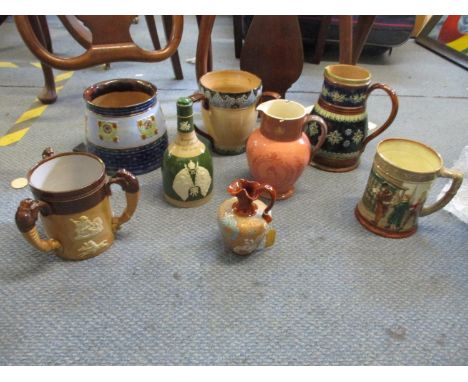 Five pieces of Royal Doulton Lambeth to include two tree handled pots, two jugs and a vase, together with a Royal Doulton Oli