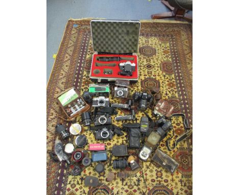 Briefcase with a Praktica camera along with other vintage camera's, lenses and accessoriesLocation: A1 