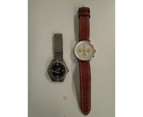 Two modern fashion watches to include a copy of a Breitling Chronometer Navitimer wristwatch Location: 
