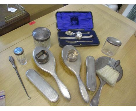 A quantity of silver items to include an engine turned ladies dressing table set, two silver topped dressing table pots (one 
