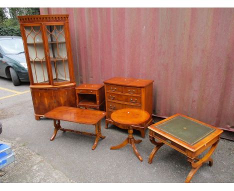 Six pieces of reproduction yew wood furniture to include a chest of drawers, corner cabinet, coffee table, lamp table, wine t