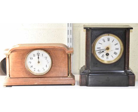 A Victorian slate mantel clock, together with another inlaid mantel clock (2).