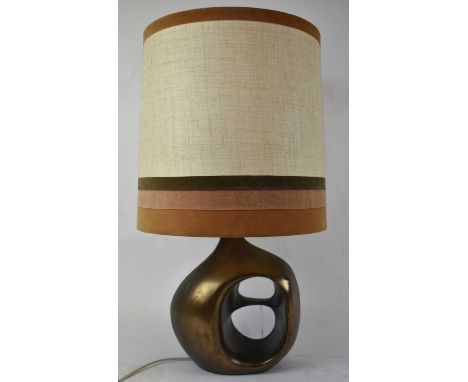 A 1970s designer table lamp of abstract form, probably American, height 36cm, with shade.