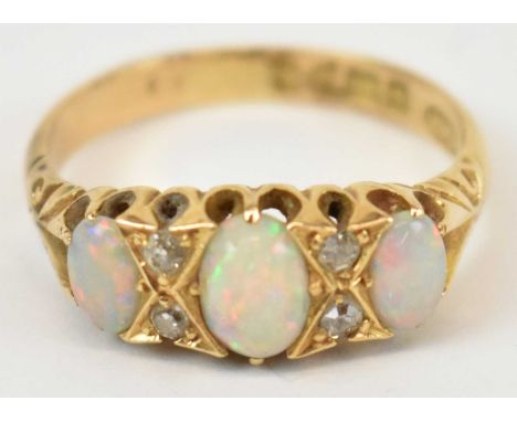 An 18ct yellow gold opal and diamond ring, size L/M, 2.1g.