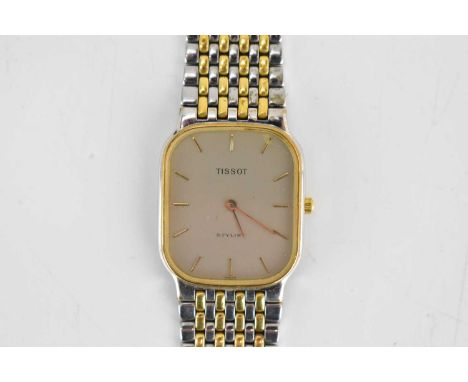TISSOT; a unisex Stylist bi-colour watch, the tank shaped dial set with raised gold baton numerals, quartz movement, engraved