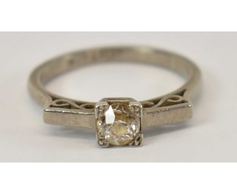 An 18ct and platinum diamond set solitaire ring, size O, 3.9g.