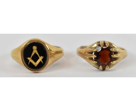 A 9ct yellow gold Masonic ring and a 9ct yellow gold garnet set ring, both approx size V, combined approx 12.2g (2).