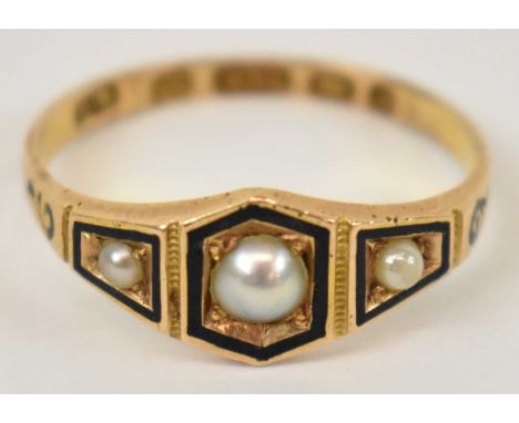 A 15ct yellow gold mourning ring set with three small pearls, size N, approx 2g.