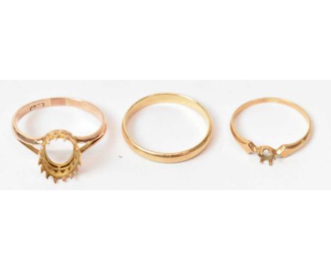 A 9ct yellow gold ring mount and two yellow metal rings, combined approx. 5.9g (3).