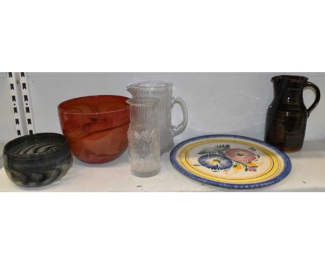 A Studio Glass bowl, signed to base, diameter 14cm, a larger orange glass bowl, diameter 20cm, a clear glass jug and carafe, 