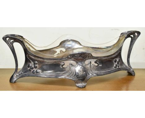 ATTRIBUTED TO WMF; an Art Nouveau style silver plated centrepiece with glass liner, width 42cm.