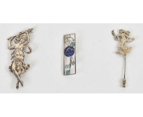 A silver and enamel Mackintosh inspired brooch, a white metal female figure brooch and a similar stick pin (3).