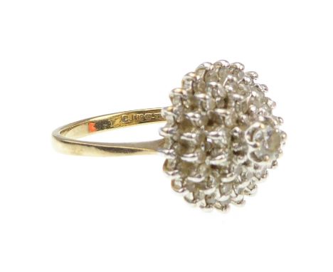 A 9ct gold diamond cluster ring in the form of a cascading cone set with approximately fifty small stones, diameter 14mm, siz
