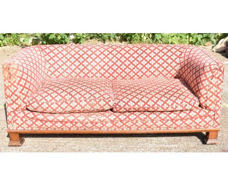A late 19th century upholstered Chesterfield sofa on substantial square supports, width 180cm.