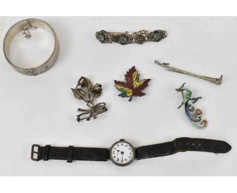 A Danish silver pendant brooch, a silver brooch modelled as a hunting whip, and two further silver/enamel brooches, also a Bi