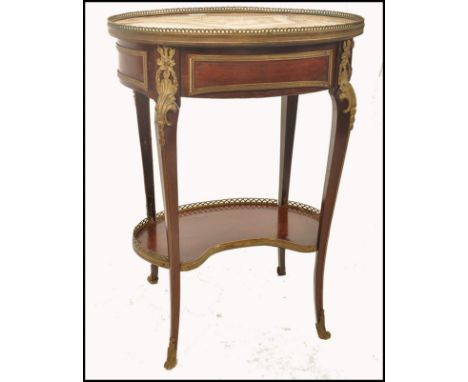 An Edwards &amp; Roberts Edwardian kingwood and marble console - lamp table. Of oval form with veined marble top having pierc