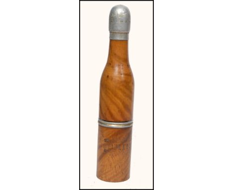 An early 20th century olive wood pipe and stanhope combination in the form of a champagne bottle with stencilled notation rea